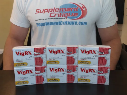 Six VigRX Plus boxes displayed on a desk in front of me during my six-month test